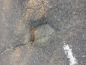 The pothole that caught my tire and me.